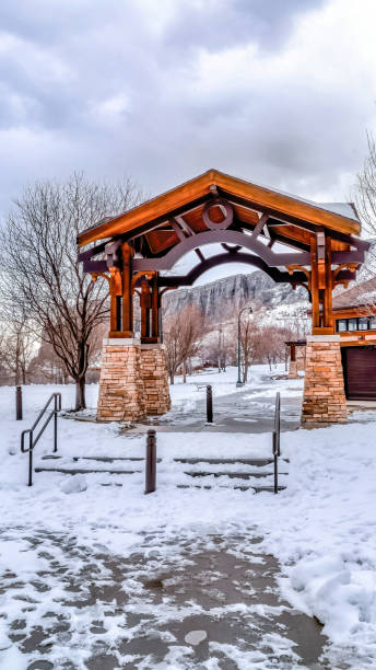 istock Pavilion with steps against snowy mountain and cloudy sky background in winter 1404101128