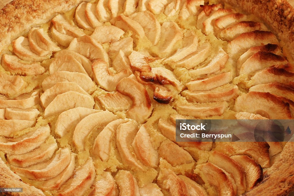 Apple Pie - closeup A homemade French authentic classic recipe.  The apple slices are laid on top of a custard layer. Apple - Fruit Stock Photo