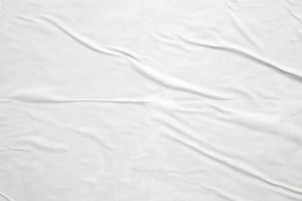 istock white crumpled and creased paper poster texture background 1404104810