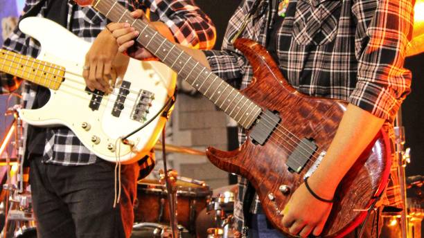 istock Musician Playing Guitar and Bass in Band Perform 1404113300