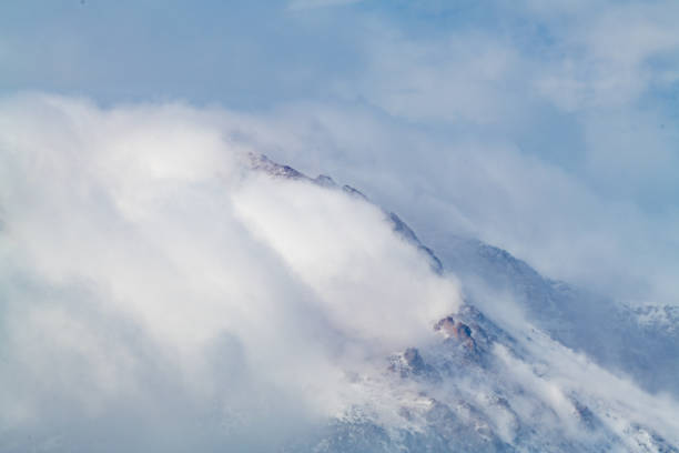 Snow, wind and clouds on Pikes Peak at 14100 feet in Colorado in western USA.