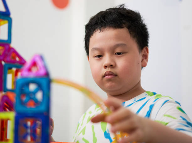 istock boy building a toy house be creative 1404118802