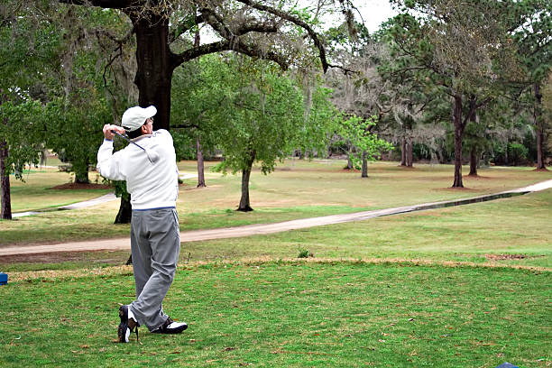 Golfer hits Drive stock photo