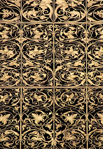 Beautiful goldleaf medieval ornamental brass pattern in a Prague cathedral