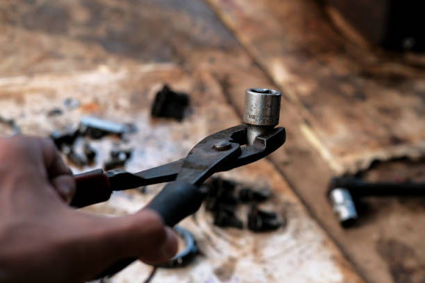 istock The socket wrench is clamped by pliers 1404126242