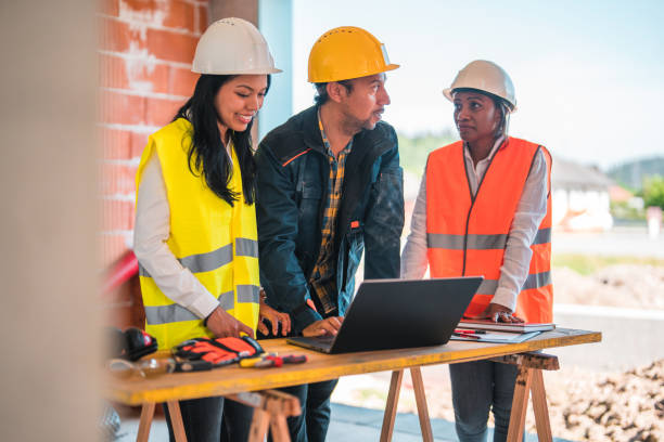 istock Diverse Group of Civil Engineers Working on Construction Site 1404132541