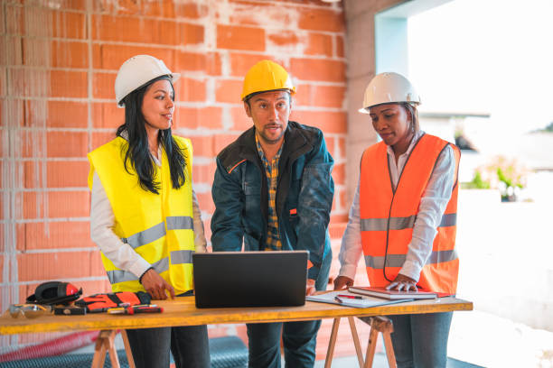 istock Diverse Group of Civil Engineers Working on Construction Site 1404132543