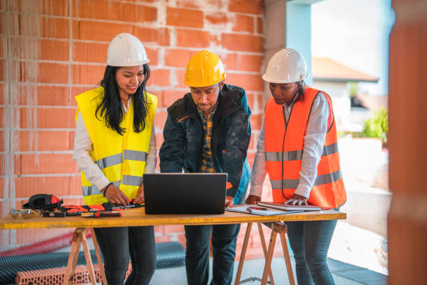 istock Diverse Group of Civil Engineers Working on Construction Site 1404132551