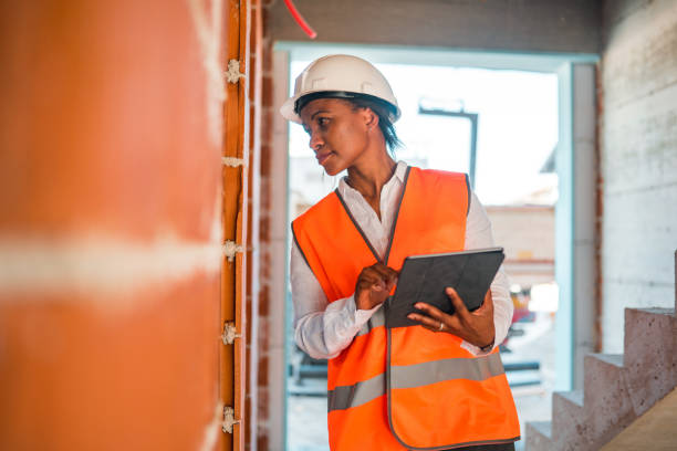 istock Black Mature Woman Supervising Construction Site 1404132720