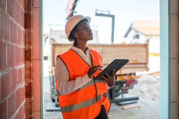 istock Black Mature Woman Supervising Construction Site 1404132726