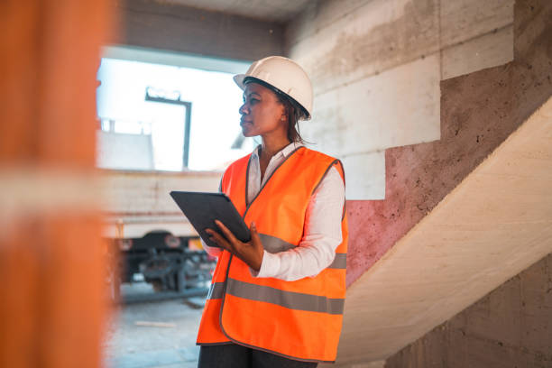 istock Black Mature Woman Supervising Construction Site 1404132729