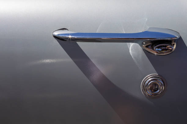 istock Chrome door handle of a classic car 1404134624