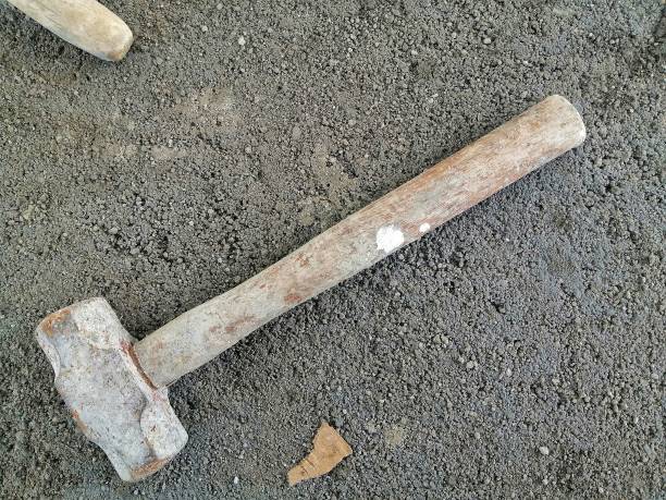istock sledgehammer on a cement concrete background. sledgehammer at construction site. 1404135738