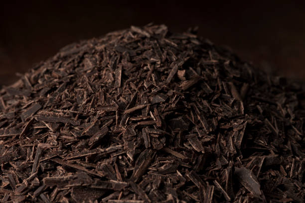 istock Chocolate shredded into pieces. Preparing to make sweets. 1404138653