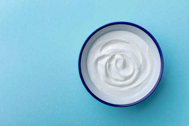 istock Greek yogurt in bowl top view. 1404139080