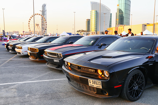 Dubai, UAE - November 15, 2018: American muscle cars Dodge Challenger take part in the Gulf Car Festival.
