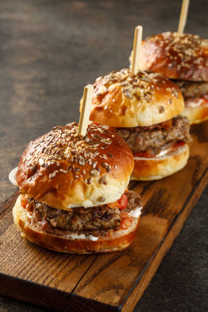 istock Close-up view of burger on wooden plate 1404142000