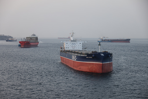 Gibraltar - June 16, 2022: Oil tankers moored as dawn breaks over the port of Gibraltar