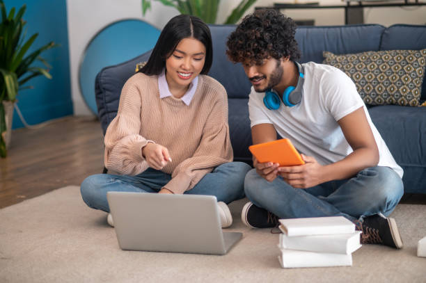 istock Young people studying together and looking involved 1404142068