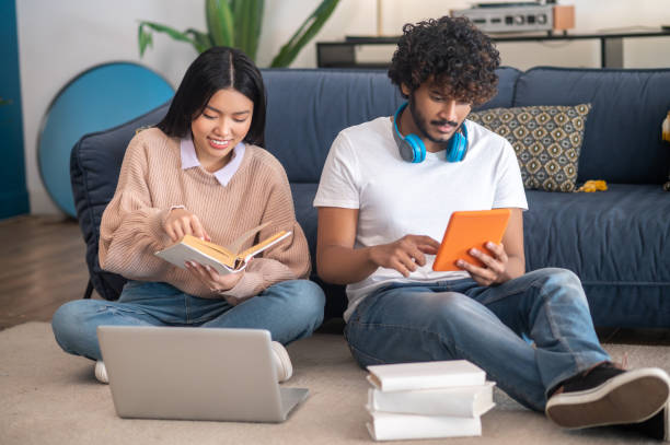 istock Young people studying together and looking involved 1404142072