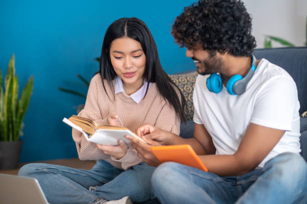 istock Young people studying together and looking involved 1404142074