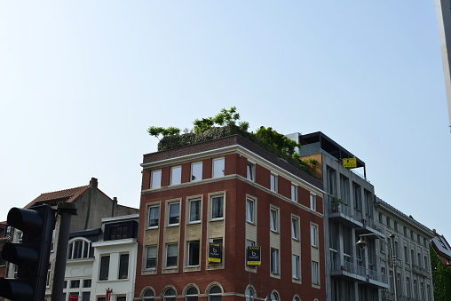 Antwerp city, Province Antwerp , Belgium - June 18, 2022: corner house apartments with beautiful roofgarden
