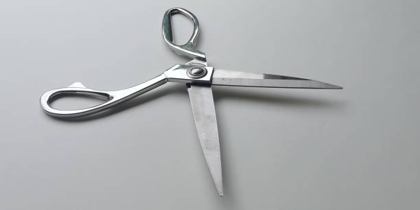 istock A silver scissor isolated on white background 1404145409