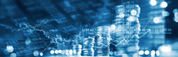 Finance and business concept. Investment graph and rows growth of coins on display of market quotes, stock market and data, rate exchange, blue color tone. stock photo