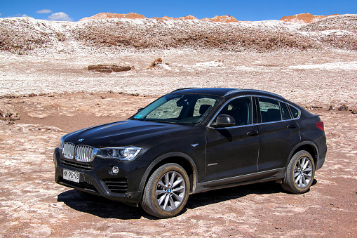 Valle de la Luna, Chile - November 17, 2015: Black luxury crossover BMW X4 (F26) in the Atacama Salt Plains.