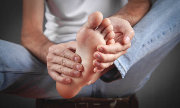 istock Man suffering from pain in foot. 1404149261