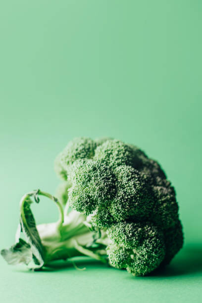 istock close-up on a colored green raw cabbage on a green background 1404149644