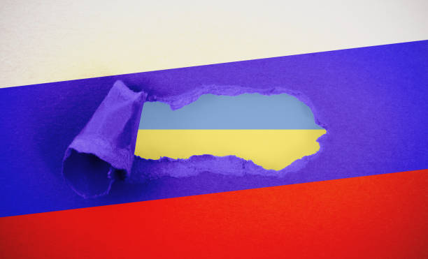 istock Ukraine header in torn Russian paper hole 1404150716