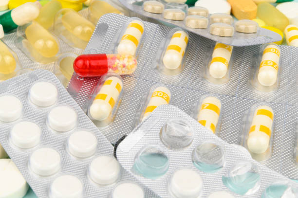 istock Full and open blister packs with capsules and tablets 1404150801