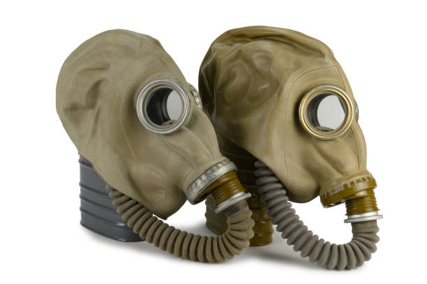 istock Two gas masks with corrugated tubes and filter boxes 1404151484