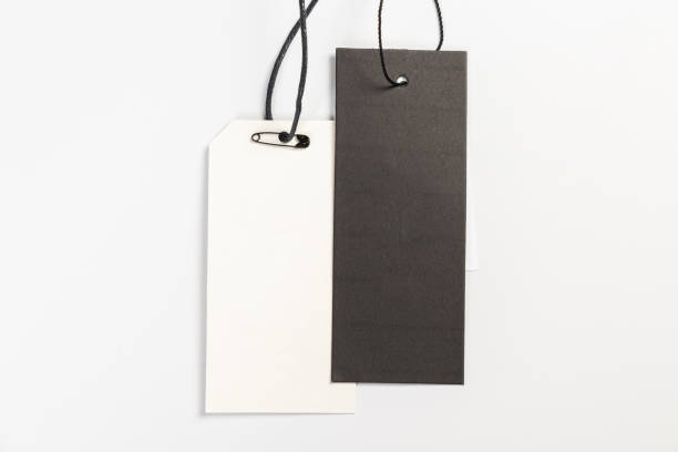 istock two fashionable blank labels for clothes on a gray background 1404151790