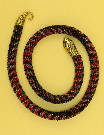 Gold ornamental bracelet on wooden surface