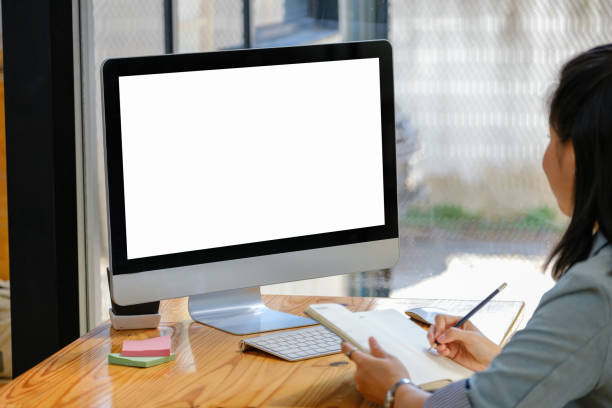 istock A white screen computer placed on the desk at work. Can put text or media in the area on the white scren 1404153385