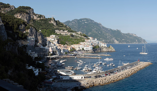 Stunning view of the village of Amalfi during a sunny day. Amalfi is a city and comune on the Amalfi Coast in the province of Salerno in the Campania region of south Italy.