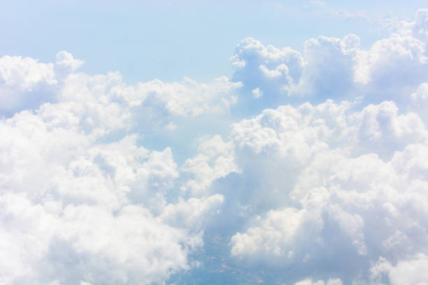 istock blue sky with clouds from the airplane 1404155929