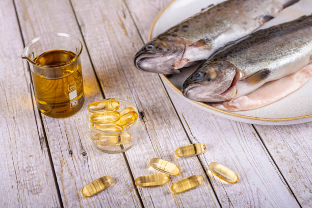 istock Food supplement capsules with oil - omega 3, vitamin A or E - with fish 1404158149