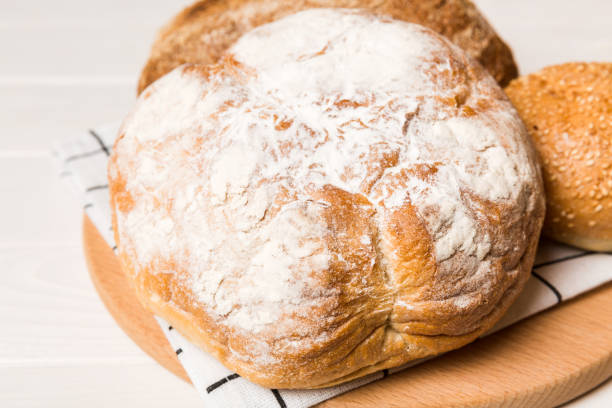 istock Homemade natural breads. Different kinds of fresh bread as background, perspective view with copy space 1404160209