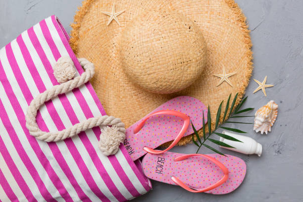 istock beach accessories flat lay top view on colored background Summer travel concept. Bag with starfish and sea shell. Top view 1404160264