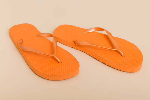 istock Beach accessories. Flip flops and starfish on colored background. Top view Mock up with copy space 1404160299