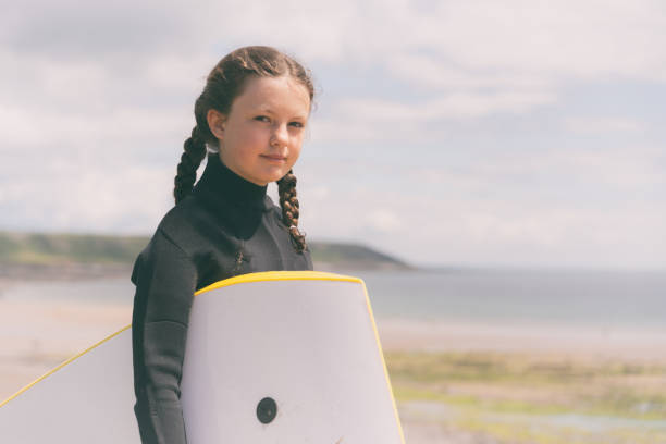 istock Young Girl Bodyboarding Vacation 1404161043