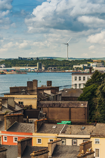 Wind turbine seen from Cobh, County Cork, Ireland - In 2020 wind turbines generated 36.3% of Ireland's electrical demand, one of the highest wind power penetrations in the world.