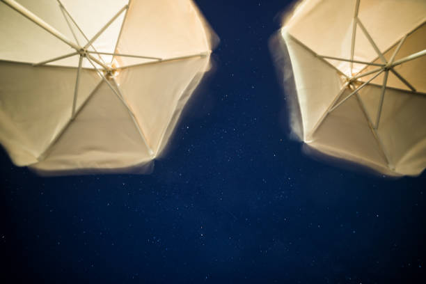 Starry sky and beach umbrellas, long exposure - Greece, Summertime