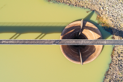 The aerial scene of a bridge over a river.