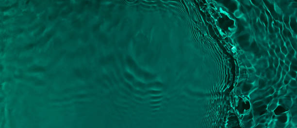 istock transparent dark green clear calm water surface texture banner 1404167349