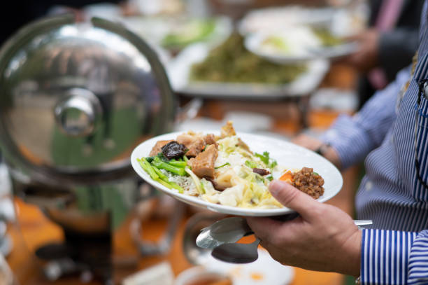 istock scooping the food, catering, dinner time 1404170118