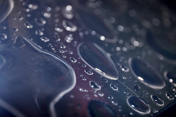 istock Drops of water on smooth metal 1404170182